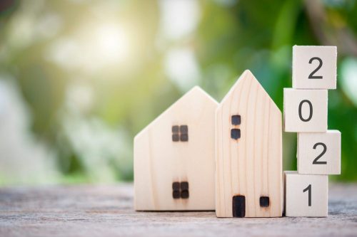 Wooden model of a house with the number 2021