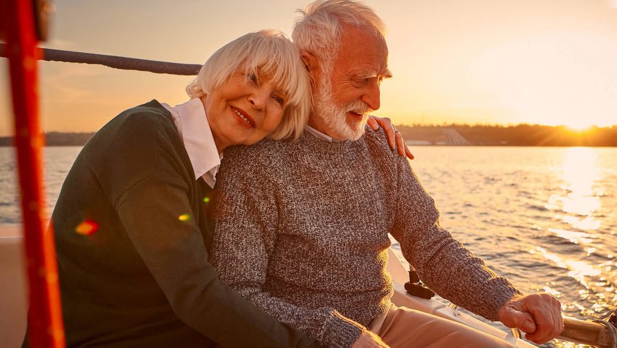 Two people hugging on a boat