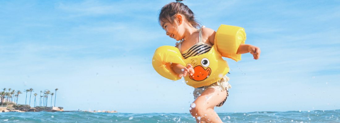 A kid playing in the sea