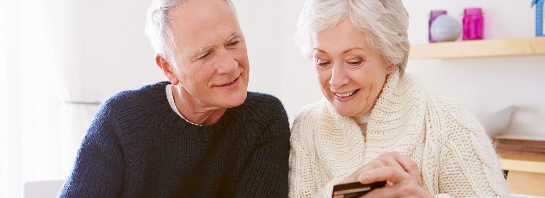 A couple looking at a bank card