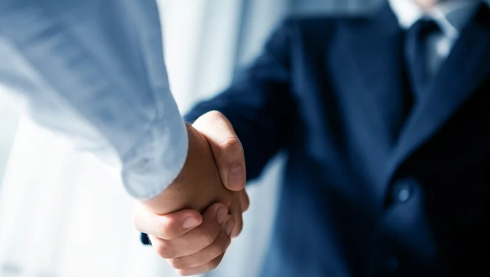 A close up image of a handshake