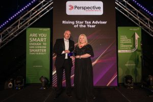 Two people receiving an award