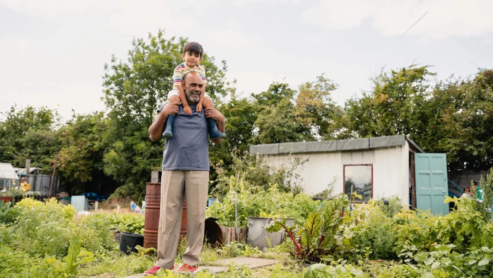 Man with child on shoulders