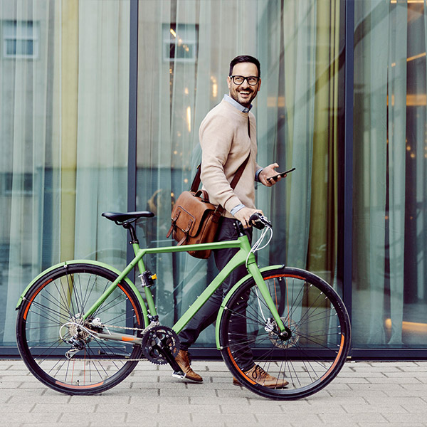 Man holding bicycle